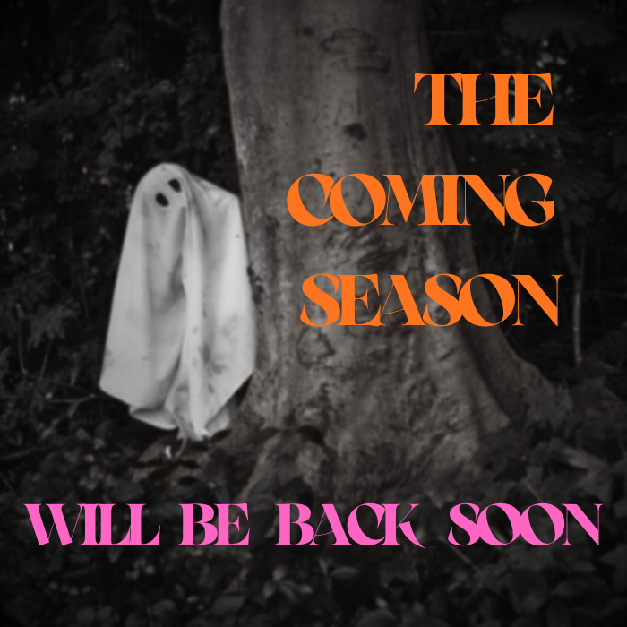 A ghost peeking out from behind a tree